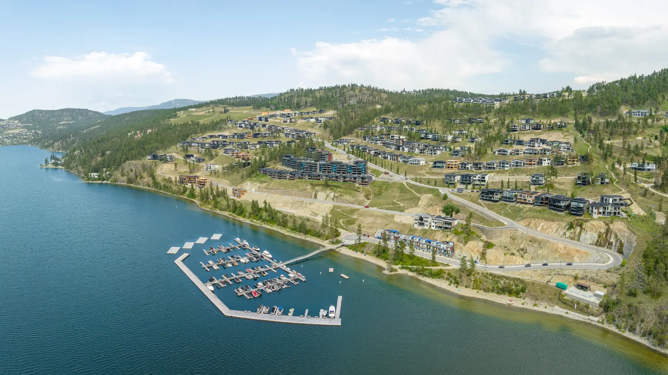 aerial shot of mckinley beach showing houses and marina