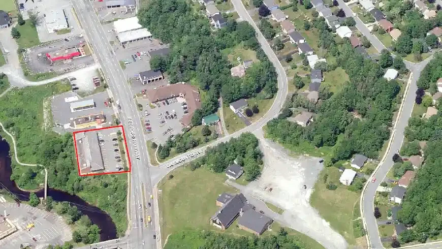 Aerial view showing Bedford Highway Centre outlined in red, located along Bedford Highway with visible adjacent roads, residential neighborhoods, and nearby commercial buildings surrounded by green space.