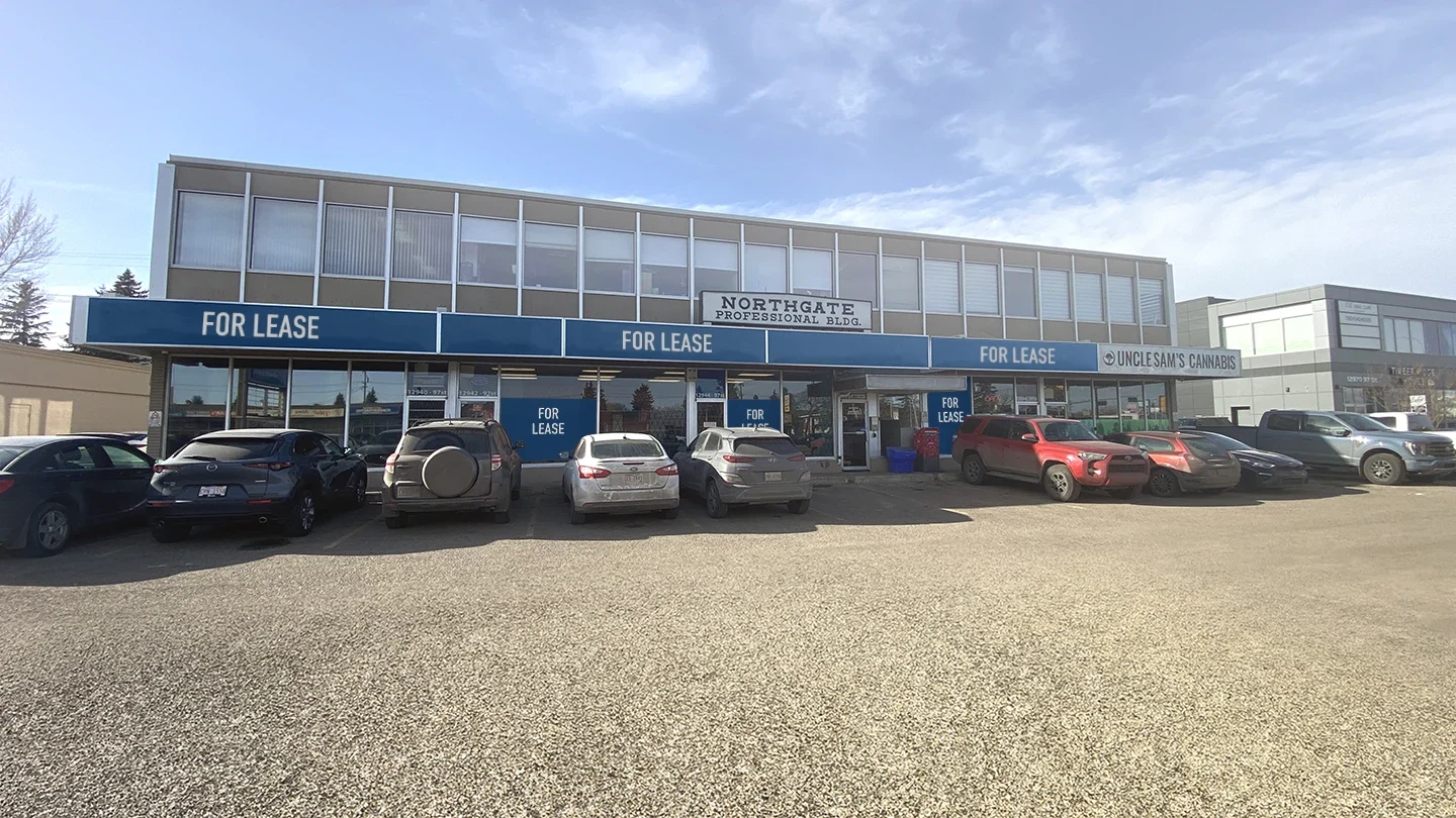 Front-facing image of Northgate Professional Building with full parking lot, visible signage for Uncle Sam’s Cannabis and multiple “For Lease” banners across ground-level windows.