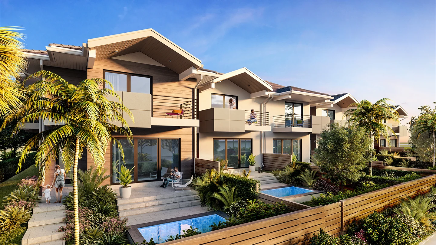 Contemporary two-story townhomes with a mix of light wood and cream exteriors, each featuring private upper balconies and ground-level patios. Some patios include small private plunge pools surrounded by tropical landscaping. People are seen relaxing and enjoying the outdoor space, including a parent walking a child. The setting includes palm trees, well-maintained gardens, and a clear blue sky.