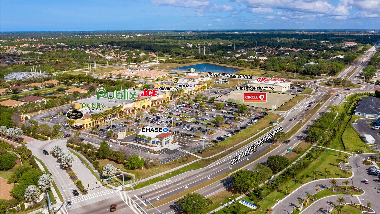 Labeled aerial photograph of Jacaranda Commons showing major tenants like Publix, CVS, Chase, and others, with surrounding roads named Jacaranda Boulevard and East Venice Avenue, and nearby residential neighborhoods and green spaces.