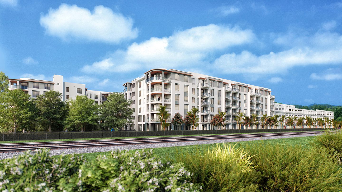 Rendering of NUVO Midtown Boca with balconies, seen from across a railway line. The building features a light-colored facade with palm trees and lush greenery in the foreground, set against a bright blue sky with scattered clouds.