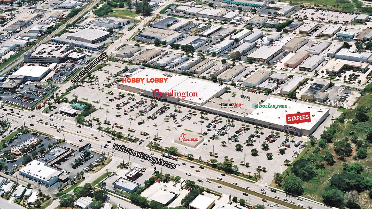 Labeled aerial view of The Plaza at Lake Park showing the positions of anchor tenants like Hobby Lobby, Burlington, Staples, Dollar Tree, GameStop, and Chick-fil-A. Major roads including Northlake Boulevard and Old Dixie Highway are labeled along the edges.