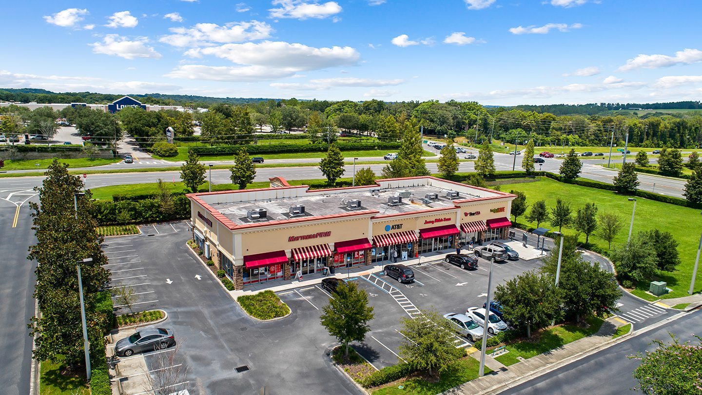 Aerial close-up of Zephyr Commons highlighting buildings and key tenants such as Publix, Planet Fitness, Mattress Firm, Chase Bank, Tropical Smoothie Café, and Five Guys, with major roadways labeled around the property.